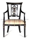 A Regency Style Ebonized and Parcel Gilt Armchair