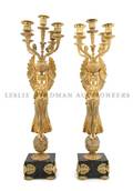 A Pair of Louis XVI Style Gilt Bronze and Marble Figural FiveLight Candelabra