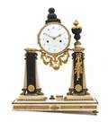 A Louis XVI Style Gilt Bronze and Marble Mantel Clock