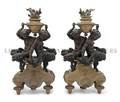 A Pair of Patinated and Gilt Bronze Figural Chenets