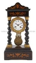 A French Ebonized and Stenciled Portico Clock