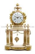 An Ormolu Mounted Alabaster Clock Pochon a Paris