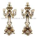 A Pair of Neoclassical Silvered and Gilt Bronze Porcelain Mounted FourLight Candelabra