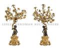 A Pair of Figural Gilt and PatinatedBronze SevenLight Candelabra