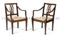 A Pair of Italian Neoclassical Walnut Open Armchairs