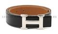 An Hermes Black and Tan Leather H Belt