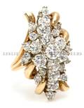A 14 Karat Yellow Gold and Diamond Cluster Ring