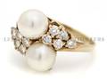 An 18 Karat Yellow Gold Pearl and Diamond Ring
