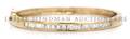 A 14 Karat Yellow Gold and Diamond Bangle Bracelet