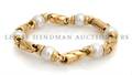 An 18 Karat Gold and Cultured Pearl Bracelet Bulgari