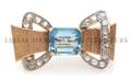 An 18 Karat Two Tone Gold Aquamarine and Diamond Brooch