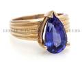 A 14 Karat Yellow Gold Tanzanite and Diamond Ring