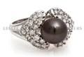 An 18 Karat Yellow Gold Cultured Tahitian Pearl and Diamond Ring