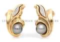 A Pair of 14 Karat Yellow Gold Cultured Tahitian Pearl and Diamond Earclips