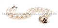 A 14 Karat Yellow Gold Cultured Pearl Sapphire and Diamond Double Strand Bracelet