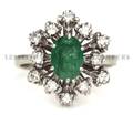 An 18 Karat White Gold Emerald and Diamond Ring