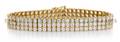 A 14 Karat Yellow Gold and Cubic Zirconia Three Row Bracelet
