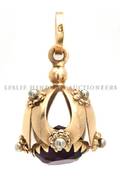 A 14 Karat Yellow Gold and Amethyst Toggle Pendant