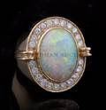 A 14 Karat Yellow Gold Opal and Diamond Ring