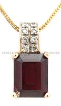 A 14 Karat Yellow Gold Garnet and Diamond Necklace