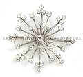 A Platinum and Diamond Snowflake Brooch