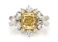An 18 Karat Gold Fancy Color and White Diamond Ring