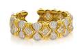 An 18 Karat Yellow Gold and Diamond Flexible Cuff Bracelet