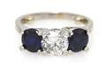A Platinum Diamond and Sapphire Three Stone Ring