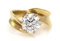 A 14 Karat Yellow Gold and Diamond Solitaire Ring