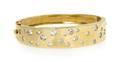 A 14 Karat Yellow Gold and Diamond Bangle Bracelet