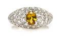 A Platinum Yellow Sapphire and Diamond Pave Ring