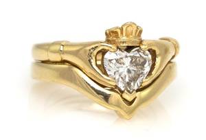 A 14 Karat Yellow Gold and Diamond Claddagh Ring