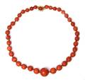 A Graduated Single Strand Coral Bead Necklace
