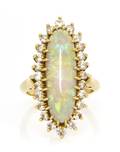 An 18 Karat Yellow Gold Opal and Diamond Ring