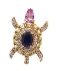 A 14 Karat Rose Gold Sapphire and Diamond Turtle Pin