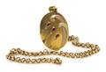 A 14 Karat Gold Ruby and Diamond Locket