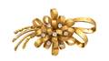 A 14 Karat Yellow Gold and Diamond Bow Brooch