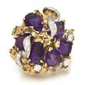 An 18 Karat Yellow Gold Amethyst and Diamond Cluster Ring