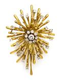 An 18 Karat Yellow Gold and Diamond Starburst Brooch