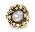 An 18 Karat Yellow Gold Cultured Baroque Pearl and Diamond Ring
