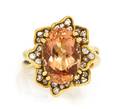 An 18 Karat Yellow Gold Precious Topaz and Diamond Ring