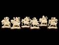 GROUP OF SIX CARVED IVORY RIDERS