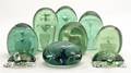 A Collection of Seven Glass Paperweights