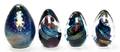 A Set of Three Italian Glass Egg Form Paperweights