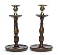 A Pair of Oak and Brass Candlesticks