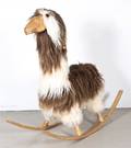 A Fur and Carved Wood Rocking Llama