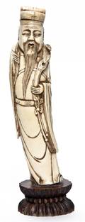 A Chinese Carved Ivory Figure of a Man