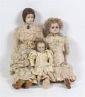 A Collection of Three Wax Head Dolls