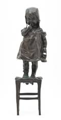 A Bronze Figure of a Girl on a Chair