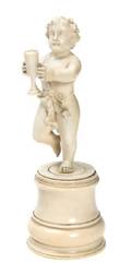 A Continental Carved Ivory Figure of a Putti